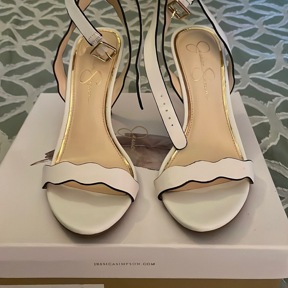 2 1/2 inch heel. White ankle shoe. Never been worn.